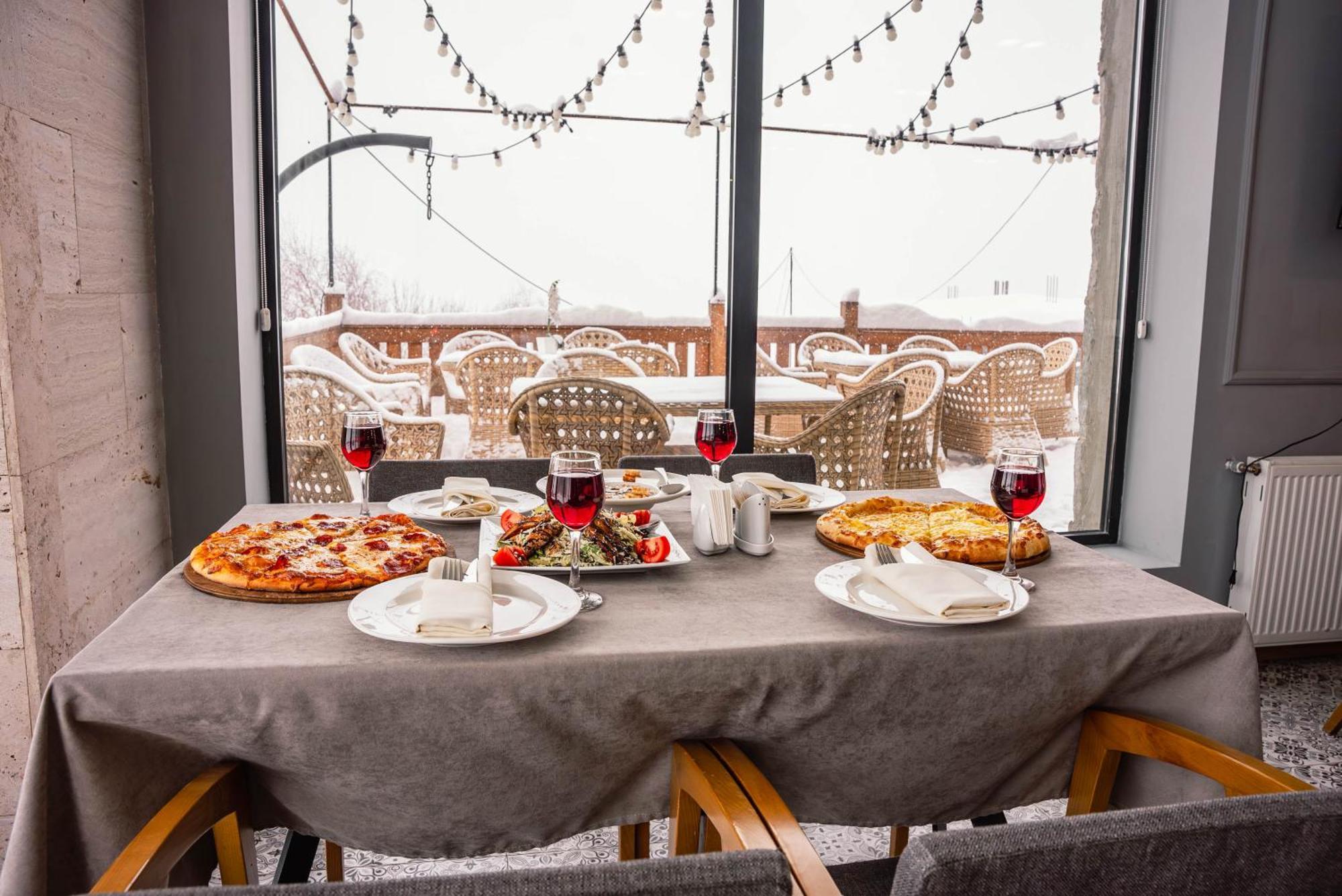 Gudauri Inn Bagian luar foto A table set for a meal